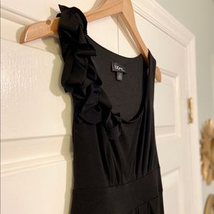 Black sleeveless dress with shoulder flower detail